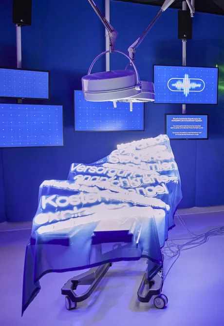 Words are projected on the operating chair.