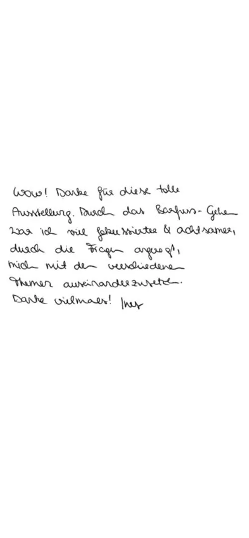 Handwritten note from a visitor in German, reading (translated): "Walking barefoot made me much more aware of the different topics, and the questions helped me to deal with them.”