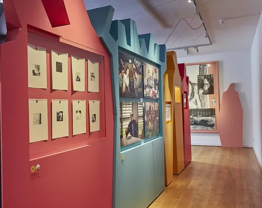 Colourful showcases shaped like silhouettes of groups of people.