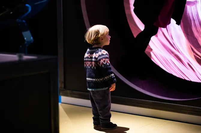 Boy watching a movie.