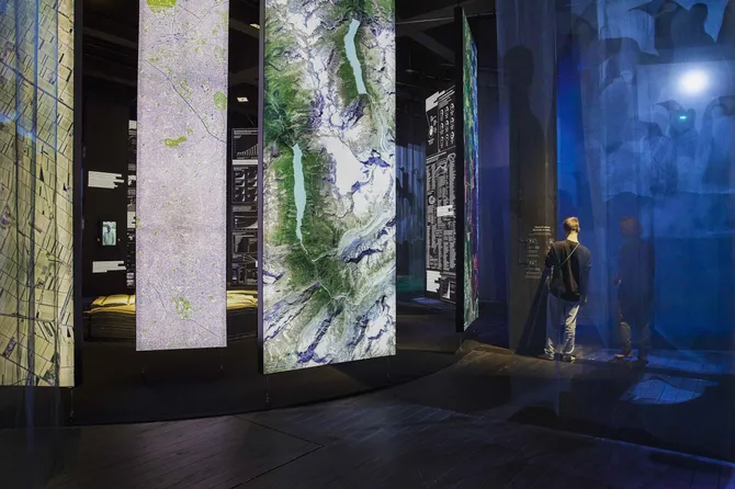Floating panels hang all the way from the ceiling, with artistic prints on the Lightbox.