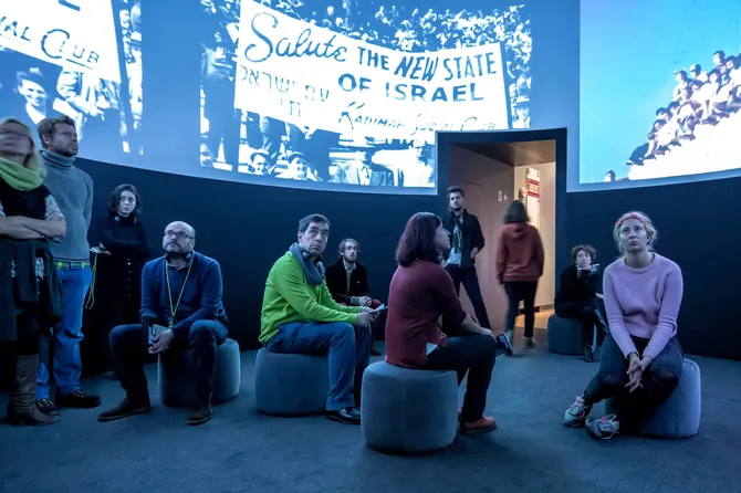 another uses film and oversized images to show the role of hotels in political power struggles.