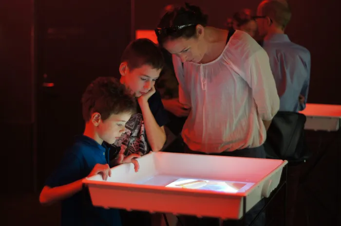 Zoom in of the dark room interactive exhibits