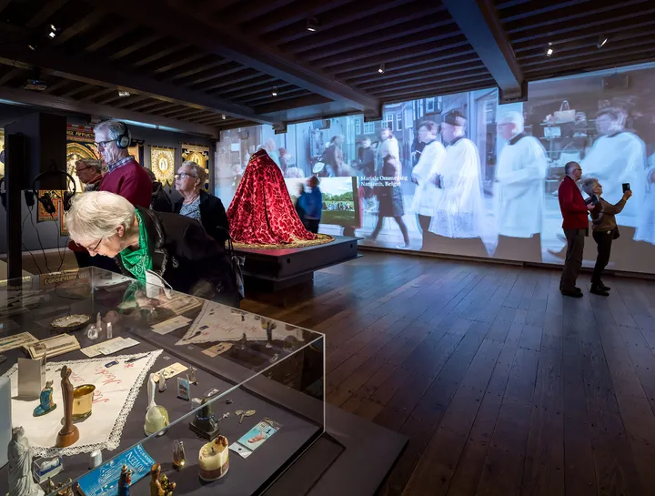In one space visitors imagine themselves between pilgrims through life-size wall projections and accompanying singing of Mary processions