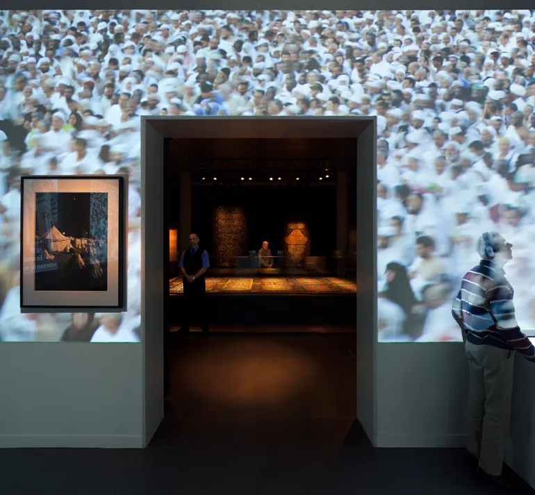 The next room is dark and serene, and brings you closest to the feeling of Mecca. A respectful setting has been created using authentic textiles that were once part of the Kaaba.